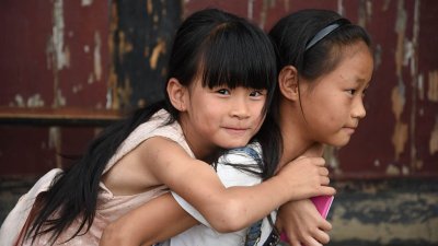 Китайцам разрешили заводить трех детей